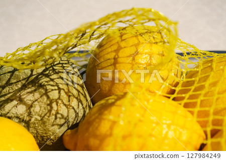 Healthy and rotten lemon fruits 127984249