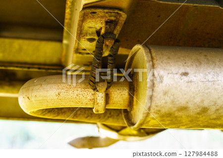 Damaged hangers of car muffler 127984488