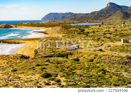Coast view with camper rv camping on sea shore, Spain 127984506
