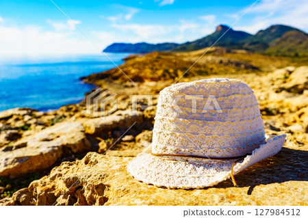 Coast landscape with summer hat, Spain. Coast landscape with summer hat, Spain. 127984512