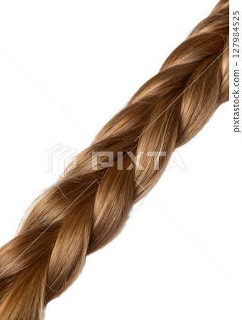 Close-up of beautifully braided light brown hair strand, intricate weaving texture 127984525