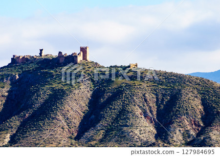Castle on hill, Tabernas desert, Spain 127984695