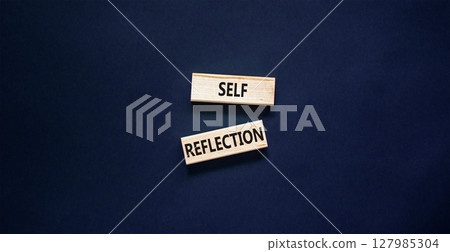 Self reflection symbol. Concept word Self reflection typed on wooden blocks. Beautiful black table black background. Business psychological and self reflection concept. Copy space. 127985304