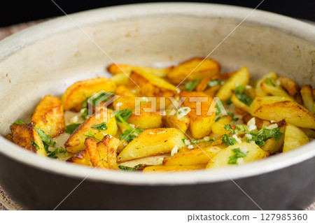 Home food - aromatic potatoes from the oven Home food - aromatic potatoes from the oven 127985360