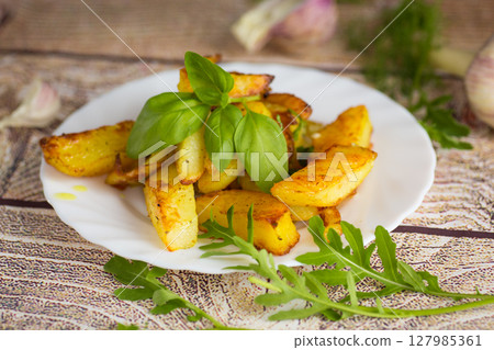 Delicious potatoes with a crispy crust for dinner Delicious potatoes with a crispy crust for dinner 127985361