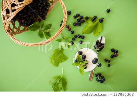 Blackcurrant in homemade yogurt, top view 127985368