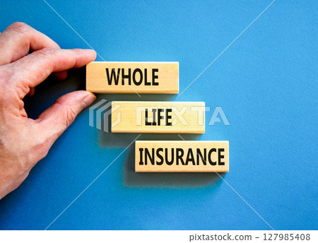 Whole life insurance symbol. Concept words Whole life insurance on beautiful wooden blocks. Beautiful blue background. Businessman hand. Business whole life insurance concept. Copy space. 127985408