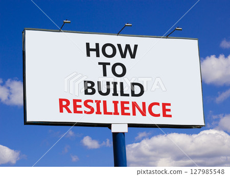How to build resilience symbol. Concept words How to build resilience on beautiful big white billboard. Beautiful blue sky clouds background. Business and how to build resilience concept. Copy space. 127985548