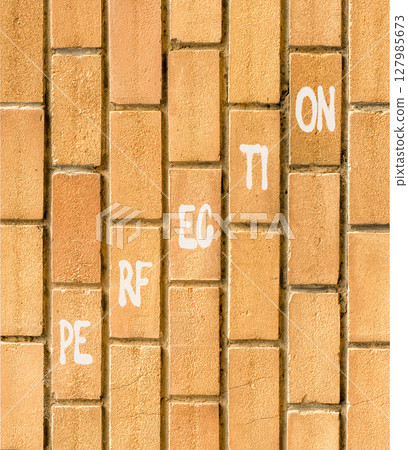 Perfection symbol. Concept word Perfection on beautiful brown bricks. Beautiful brown brick wall background. Business perfection concept. Copy space. 127985673