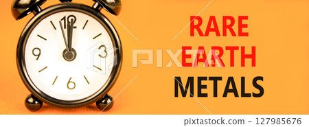 Rare earth metals symbol. Concept words Rare earth metals on beautiful orange paper. Alarm clock. Beautiful orange paper background. Business and rare earth metals concept. Copy space. Rare earth metals symbol. Concept words Rare earth metals on beautiful orange paper. Alarm clock. Beautiful orange paper background. Business and rare earth metals concept. Copy space. 127985676