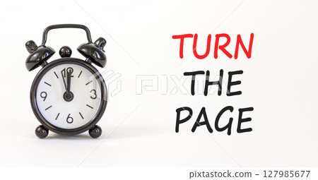 Turn the page symbol. Concept words Turn the page on beautiful white paper. Alarm clock. Beautiful white paper background. Business motivational lifestyle turn the page concept. Copy space. Turn the page symbol. Concept words Turn the page on beautiful white paper. Alarm clock. Beautiful white paper background. Business motivational lifestyle turn the page concept. Copy space. 127985677