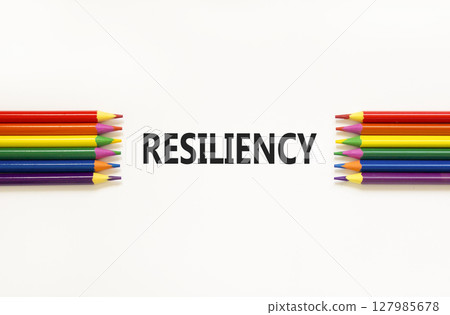 Resiliency symbol. Concept word Resiliency on beautiful white paper. Beautiful white paper background. Beautiful colored pencils. Business resiliency concept. Copy space. 127985678