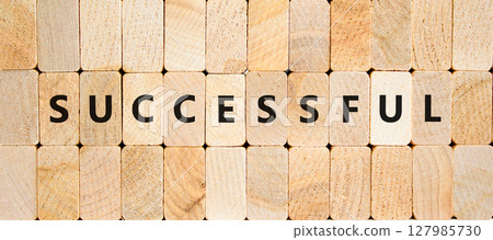 Successful symbol. Concept word Successful on beautiful wooden blocks. Beautiful wooden blocks background. Business successful concept. Copy space. 127985730