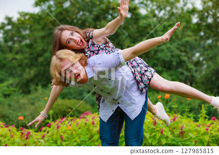 Couple having fun together outdoor. Couple having fun together outdoor. 127985815