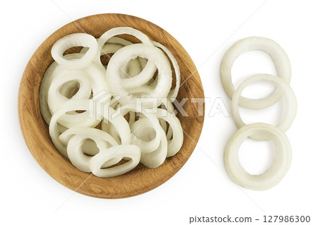 Onion slices in a wooden bowl isolated on a white background. Top view. Flat lay. 127986300