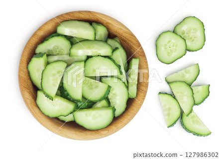 Sliced cucumber in wooden bowl isolated on white background with full depth of field. Top view. Flat lay. 127986302