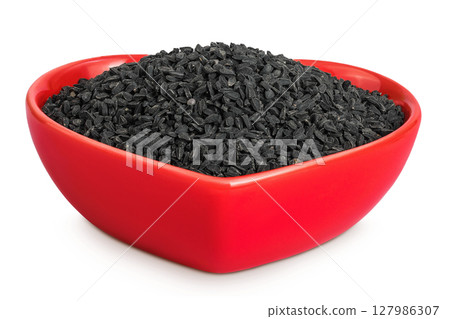 Nigella sativa or Black cumin in ceramic bowl isolated on white background 127986307
