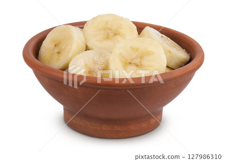 peeled banana pieces in ceramic bowl isolated on white background 127986310