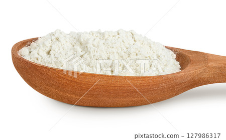 White flour in wooden spoon isolated on white background White flour in wooden spoon isolated on white background 127986317