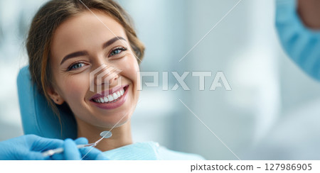 Radiant Smile at the Dentist: Happy Patient Undergoing Professional Dental Examination for Optimal Oral Health and Confident Appearance. 127986905