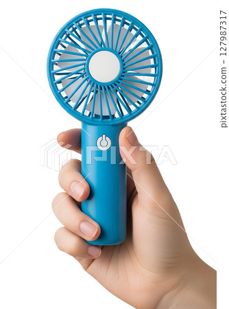 Handheld blue mini fan held in hand on transparent background, portable cooling device Handheld blue mini fan held in hand on transparent background, portable cooling device 127987317