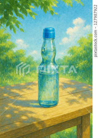 夏日靜物圖：樹蔭下的桌子上放著一瓶拉姆尼汽水 127987922