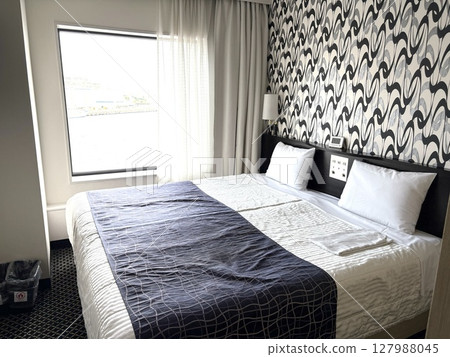 Stylish bedroom in a hotel Stylish bedroom in a hotel 127988045
