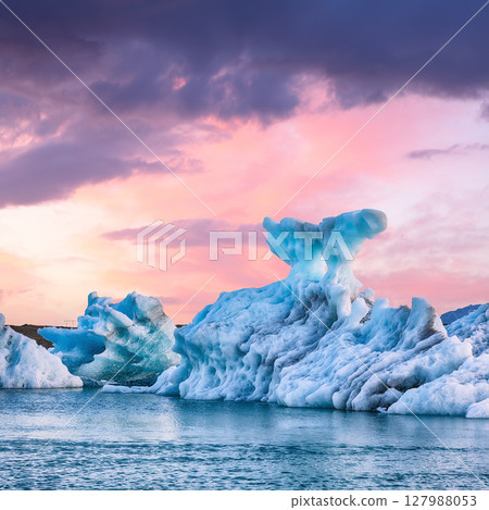 Ramarkable  landscape with floating icebergs in Jokulsarlon glacier lagoon at sunset. 127988053