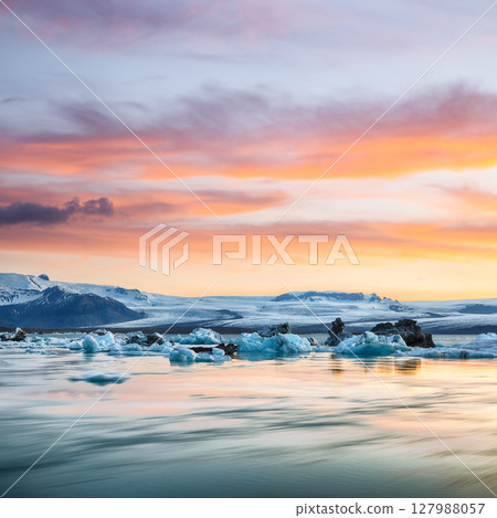 Ramarkable landscape with floating icebergs in Jokulsarlon glacier lagoon at sunset. Ramarkable landscape with floating icebergs in Jokulsarlon glacier lagoon at sunset. 127988057