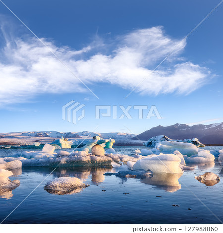 Impressive floating icebergs in Jokulsarlon glacier lagoon. Impressive floating icebergs in Jokulsarlon glacier lagoon. 127988060