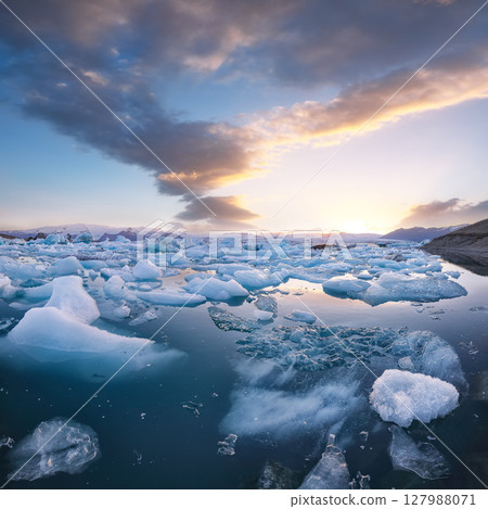 Excellent  landscape with floating icebergs in Jokulsarlon glacier lagoon at sunset. 127988071