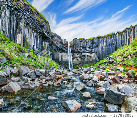 Ramarkable view of Svartifoss waterfall with basalt columns on southern part of Iceland. Ramarkable view of Svartifoss waterfall with basalt columns on southern part of Iceland. 127988092