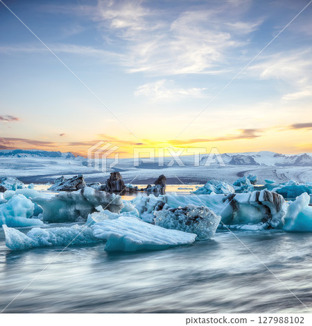 Excellent  landscape with floating icebergs in Jokulsarlon glacier lagoon at sunset. 127988102