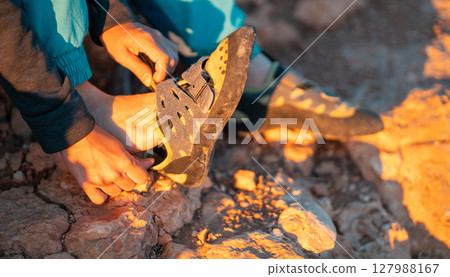 ..Girl is wearing climbing shoes, closeup view... 127988167
