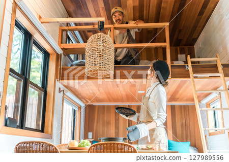 Mother, mom, housewife preparing meals on family trip, cottage, bungalow Mother, mom, housewife preparing meals on family trip, cottage, bungalow 127989556