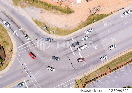Aerial view of multi lane road intersection with multiple vehicles traveling in different directions traffic movement at road junction in Boiling Springs, Spartanburg South Carolina Aerial view of multi lane road intersection with multiple vehicles traveling in different directions traffic movement at road junction in Boiling Springs, Spartanburg South Carolina 127990221
