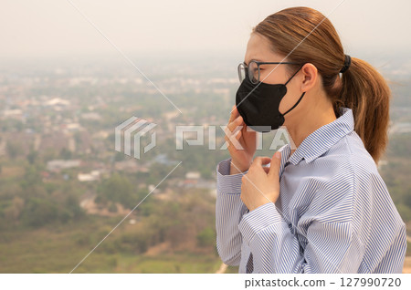 Asian businesswoman coughing becaused of allergy from Bad air pollution (PM2.5). Asian businesswoman coughing becaused of allergy from Bad air pollution (PM2.5). 127990720