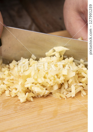 The process of making furikake using shiso husks that have been used to make red shiso syrup, with minced ginger 127991289