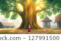 A young Thai girl stands under the tree, looking up with hands together in a respectful gesture. 127991500