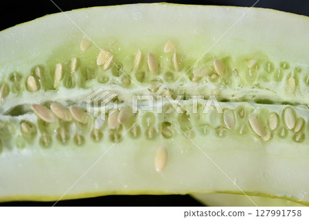 Cross section of next season's seed cucumber 127991758
