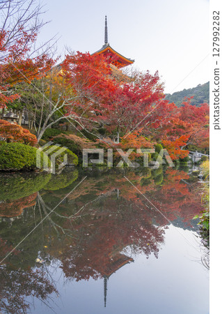 Reflection of the three-story pagoda of Kiyomizu-dera Temple in autumn surrounded by autumn leaves Reflection of the three-story pagoda of Kiyomizu-dera Temple in autumn surrounded by autumn leaves 127992282