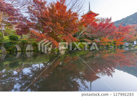 Reflection of the three-story pagoda of Kiyomizu-dera Temple in autumn surrounded by autumn leaves Reflection of the three-story pagoda of Kiyomizu-dera Temple in autumn surrounded by autumn leaves 127992283