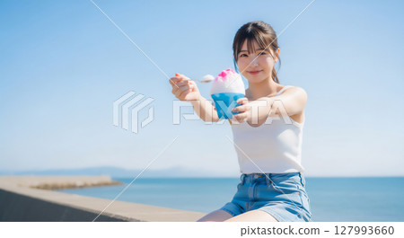 Shaved ice time to feel cool under the blue sky 127993660