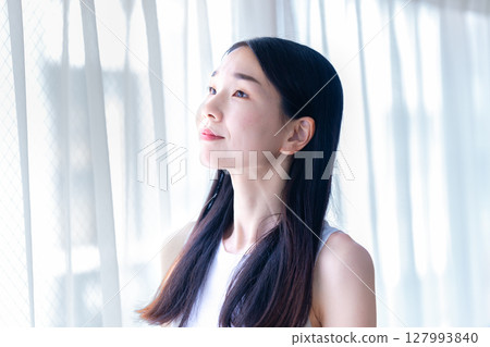 Woman wearing a tank top 127993840