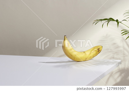 A cozy backdrop with fresh fruits and grass on a table with natural sunlight and shadows. A cozy backdrop with fresh fruits and grass on a table with natural sunlight and shadows. 127993997