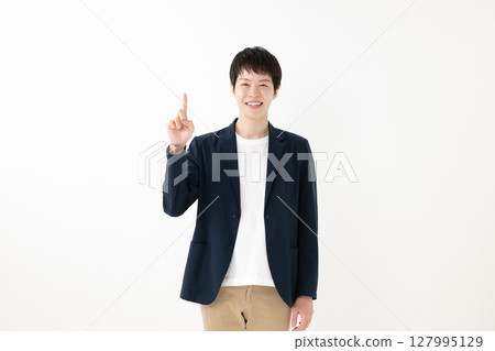 A pointing businessman 127995129