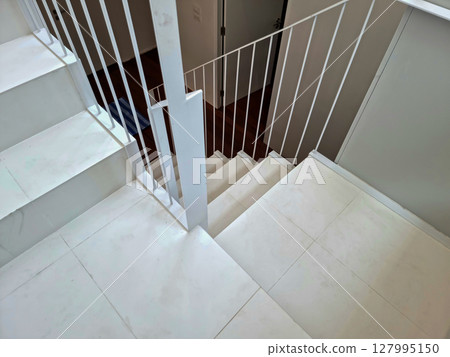 White wooden staircase frame on abstract background White wooden staircase frame on abstract background 127995150