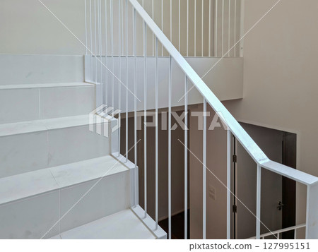 White wooden staircase frame on abstract background 127995151