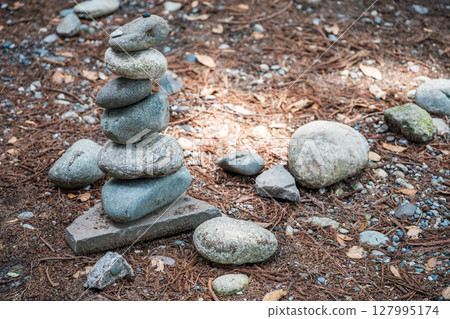 Balanced stone tower created from natural rocks in Sichuan provi 127995174