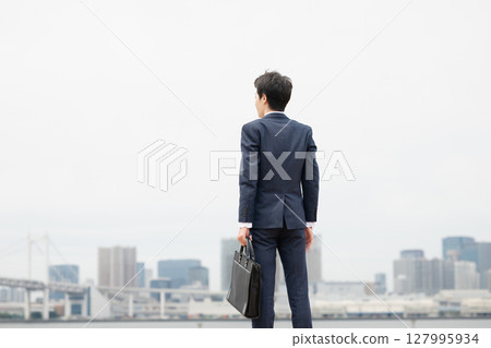 A back view of a businessman A back view of a businessman 127995934